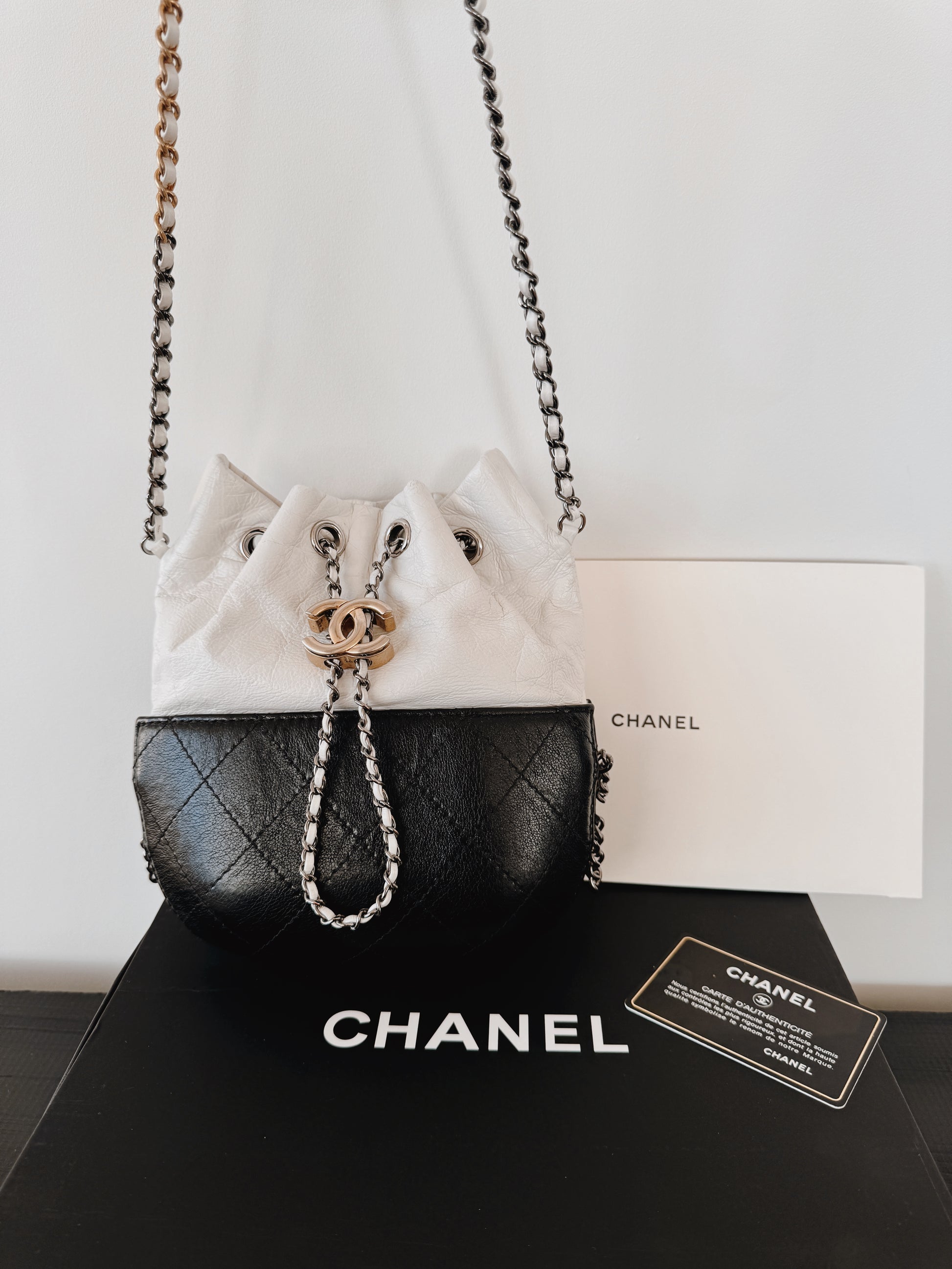CHANEL Aged Calfskin Quilted Gabrielle Bucket Bag - White & Black